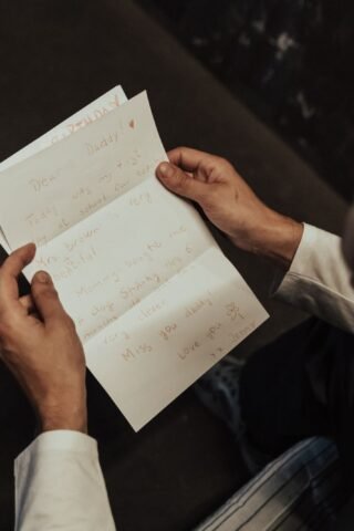 Man reading a letter, like a COBRA election notice