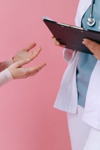 Doctor consulting with a patient about their health history