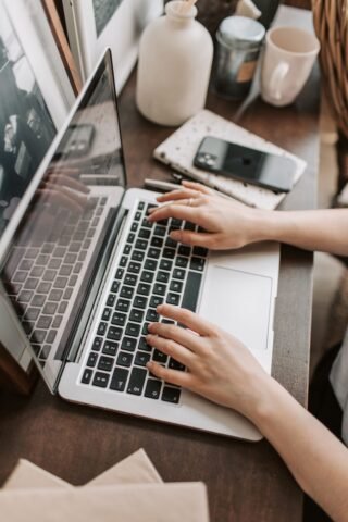 Self-employed freelancer working on a laptop at home