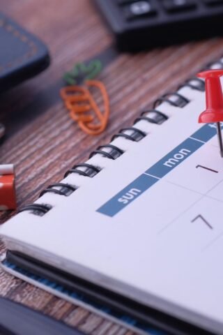 Pin marking an important enrollment date on a calendar